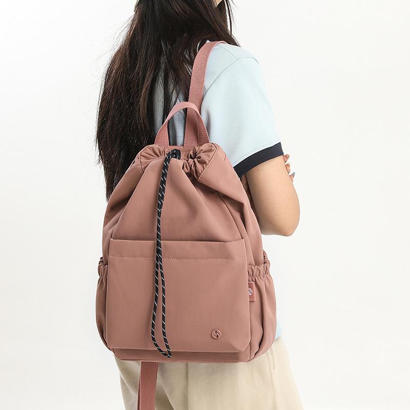 Schoolbag versatile backpack large-capacity design sense commuting travel large-capacity schoolbag waterproof and wear-resistant backpack wholesale