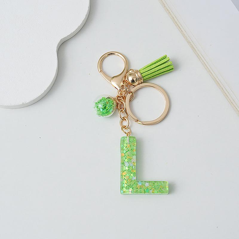

Брелок з літерою від A до Z, 26 ініціалів алфавіту, маленька кулька з китицями, брелоки для ключів, вишуканий рюкзак, прикраса, аксесуари, подарунки L