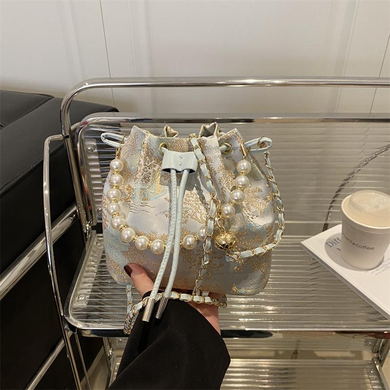 

Премиальная текстура Интернет-знаменитость весна новинка шоппинг жемчужный универсальный зарубежный стиль милая сумка-ведро женский тренд сумка-мессенджер