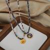 European-American Niche: Blue Spirit Grey Natural Stone Handmade Necklace with Starry Sky Glaze Angel Pendant in Gold-Plated Titanium Steel.