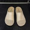Versatile soft-soled bag head half slippers women's 2025 summer new French high-end single shoes round head hollowed out outside sandals