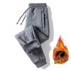 Casual trousers men's autumn and winter new fleece thickened tied pockets zipper large size loose casual sweatpants