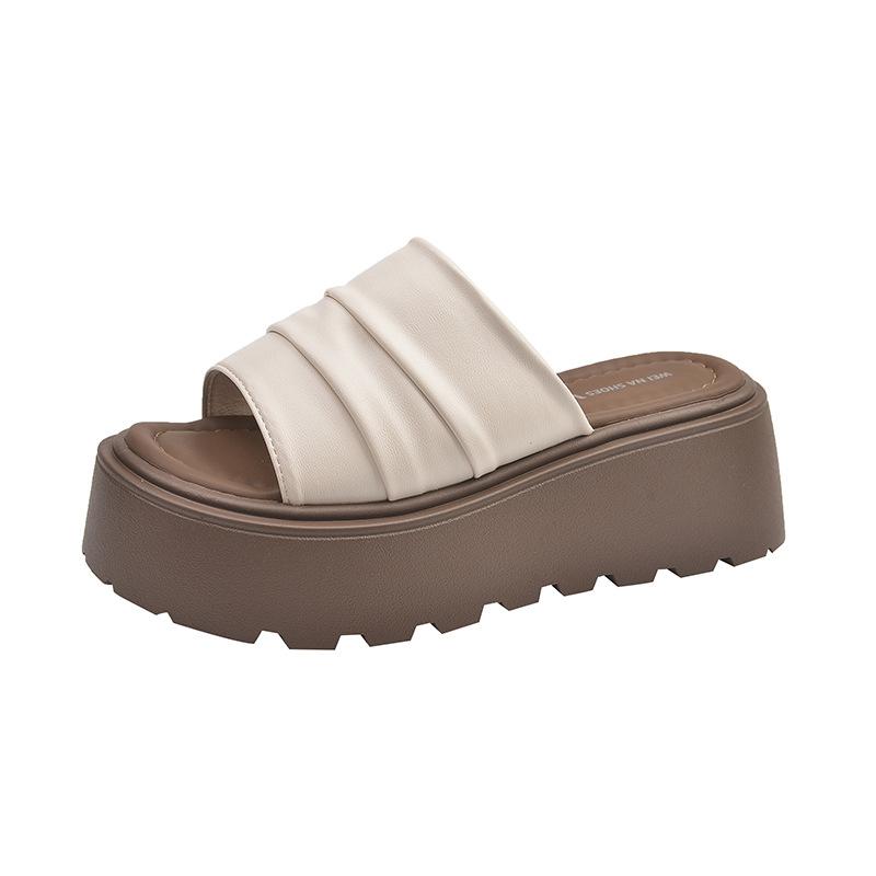 

Thick-soled heightened wrinkled leather one-word slippers women s summer wear 2025 new models with skirts, muffin soles, sandals 40