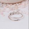 Adjustable Silver Fidget Ring: Minimalist anxiety jewelry with three movable spinner beads and a simple open wrap design.