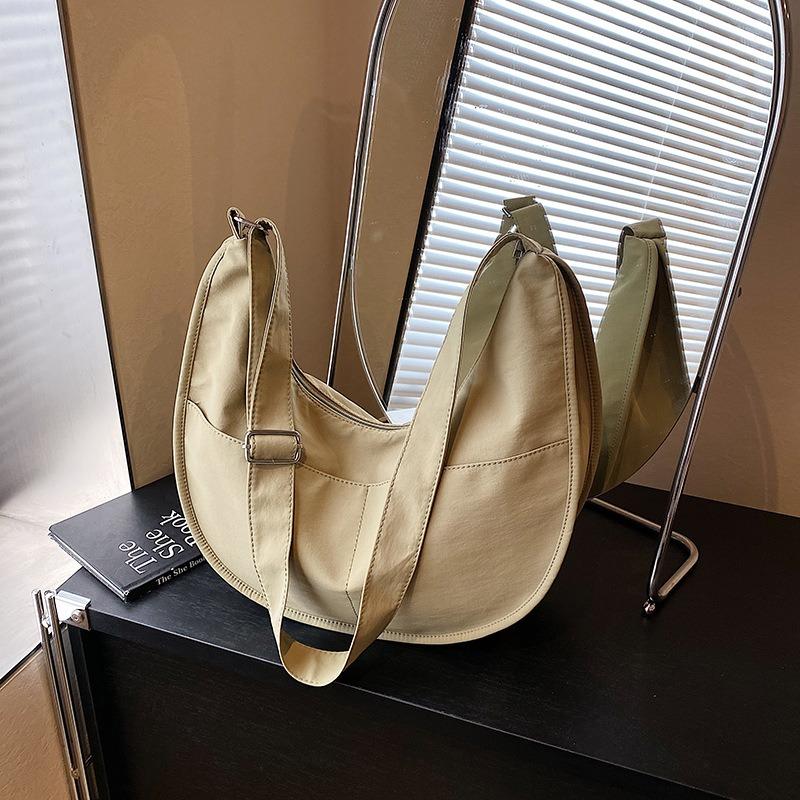 Canvas bag women's large-capacity new niche design sense summer shoulder messenger bag versatile commuter dumpling bag