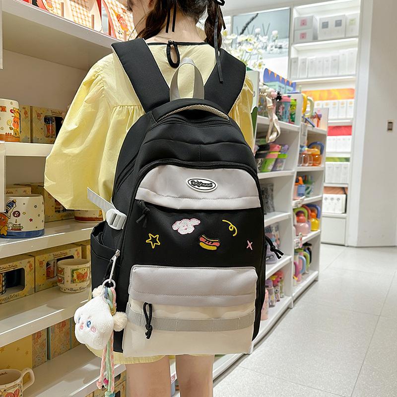 New small fresh contrasting color schoolbag women's light casual outdoor backpack junior high school students high value backpack