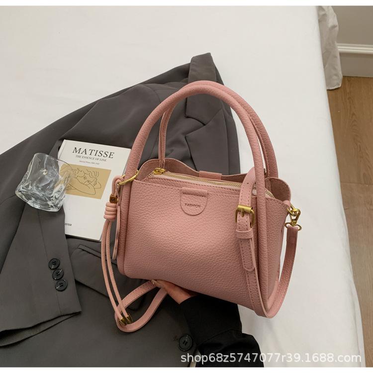 Simple design solid color handbag 2025 new Korean niche retro commuter crossbody bag textured commuter bucket bag