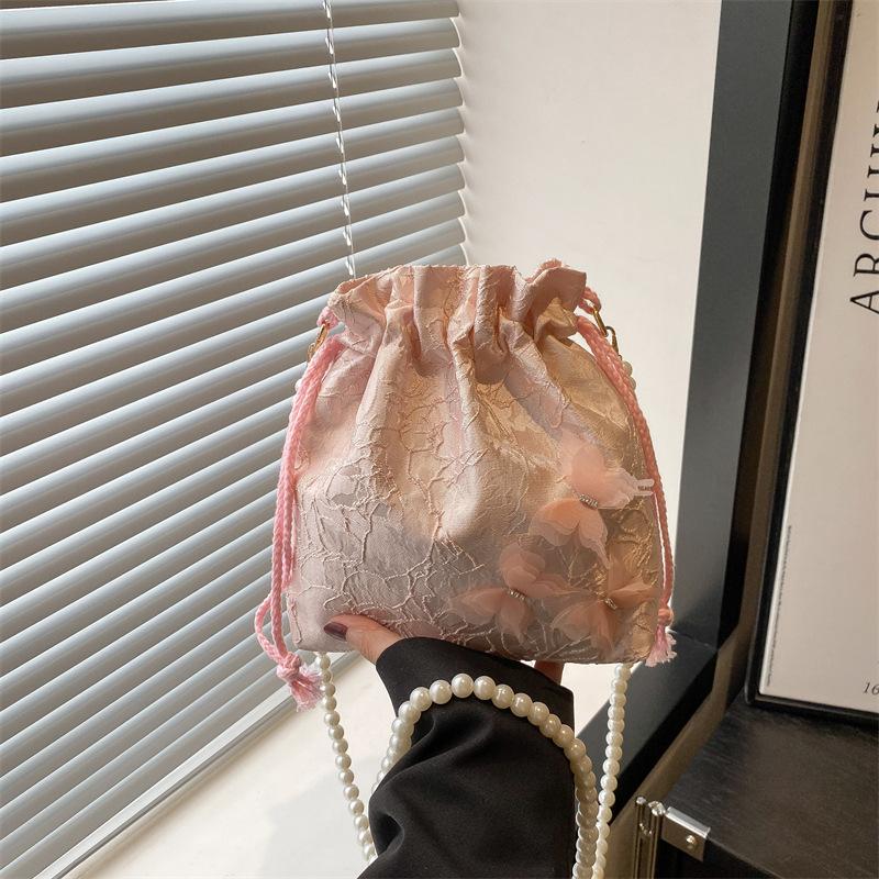 

Stylish and beautiful lace butterfly bucket bag, new niche simple and high-end shoulder messenger bag розовый