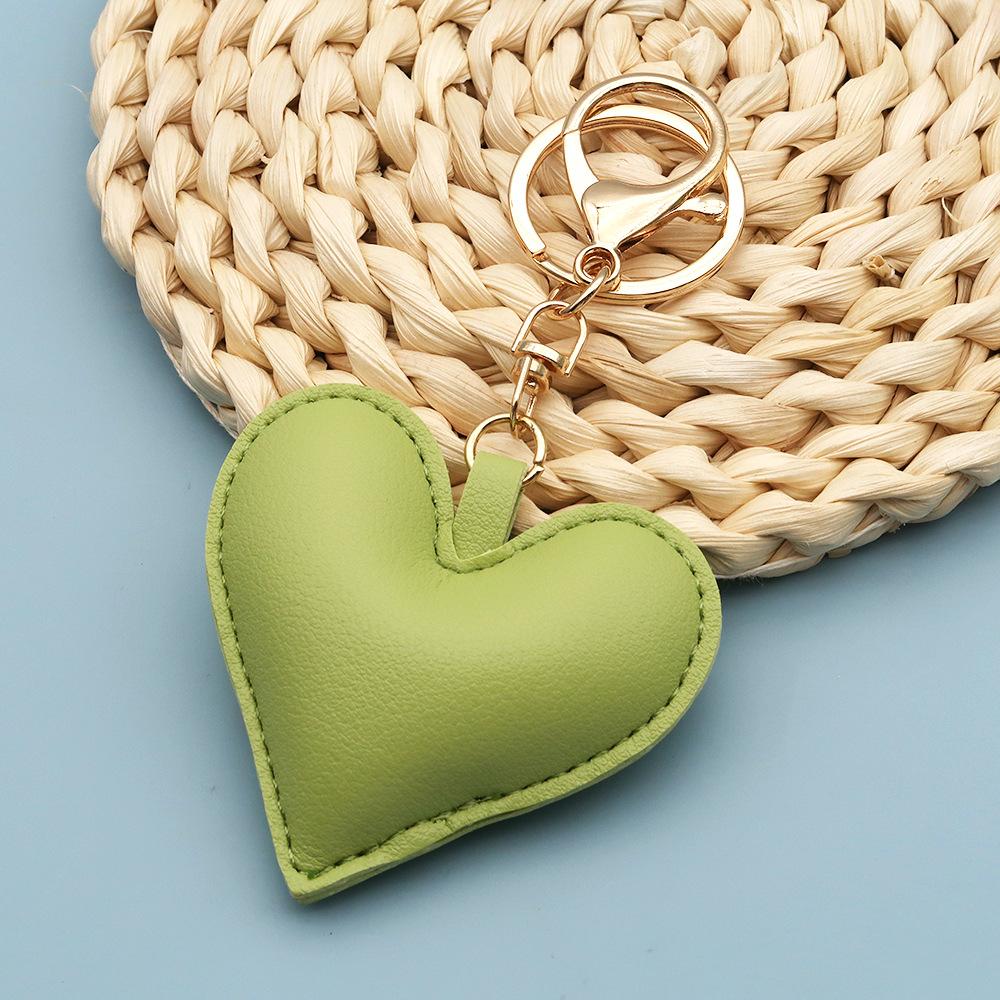 Spot wholesale PU simple peach heart bag pendant Xiaohongshu explosive love couple pendant keychain bag lanyard