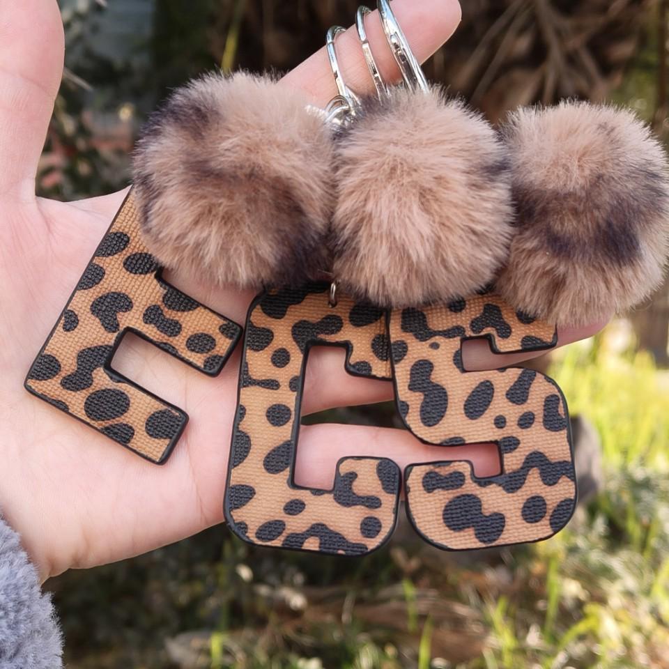 Western Cowboy Leopard Print Leather Keychain with Plush Ball Accessory