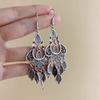 Retro court style, high-end sense, niche ethnic style earrings, ancient style, fringed water drop earrings, new Chinese personalized earrings.
