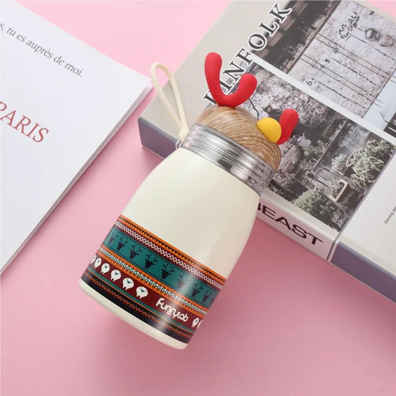 

Portable Handle Cartoon Insulated Cup with Christmas Reindeer Design 304 Stainless Steel Suitable for Students 360ml білий