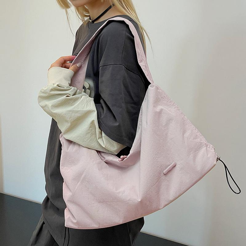 Korean style spring and summer new women's solid color high-end niche shoulder crossbody armpit bag