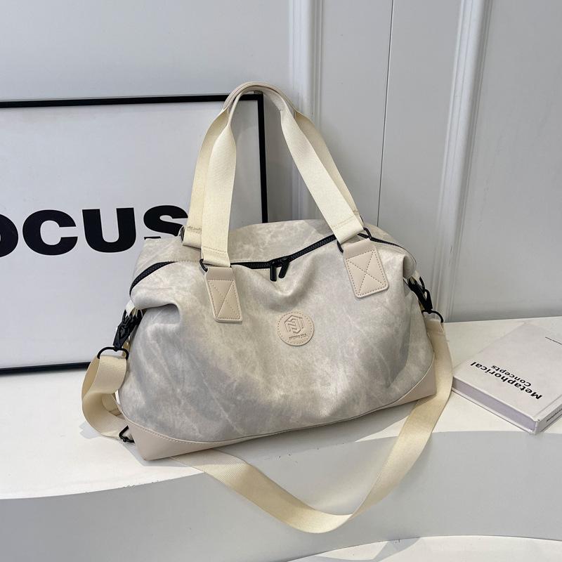 Large-capacity hand-held travel bag Women's fashion and light going out luggage bag Men's business trip travel storage boarding bag