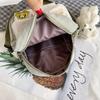 Piccola borsa a tracolla da donna in tela con tasca per cellulare e design a blocchi di colore, ideale per l'uso quotidiano.