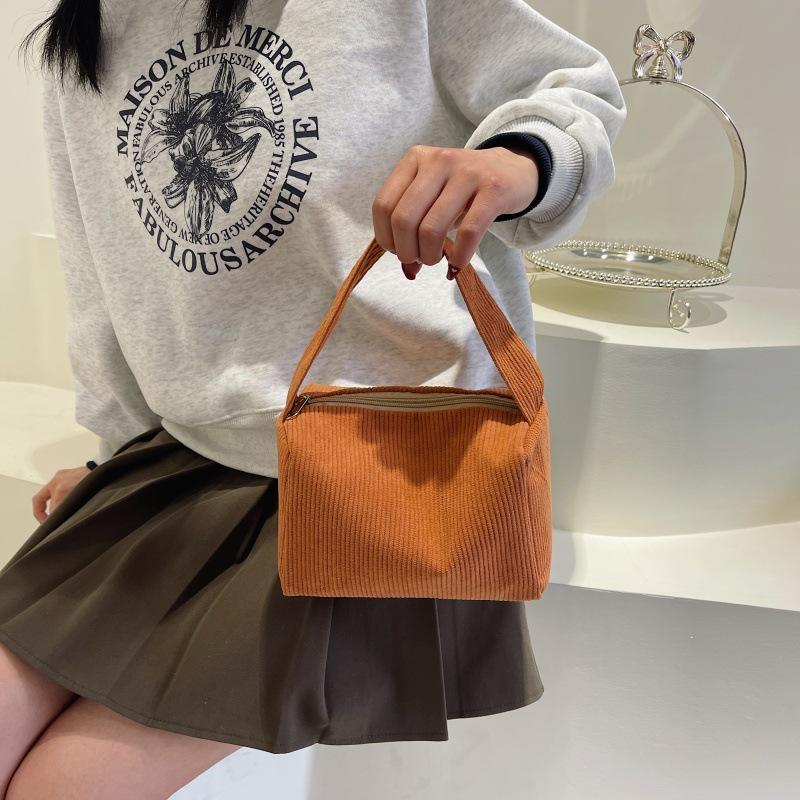 Stylish and simple solid color corduroy cosmetic bag, light and large-capacity portable storage bag