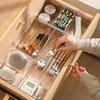 Expandable Transparent Storage Box with Dividers for Utensils, Cosmetics, and Sundries.