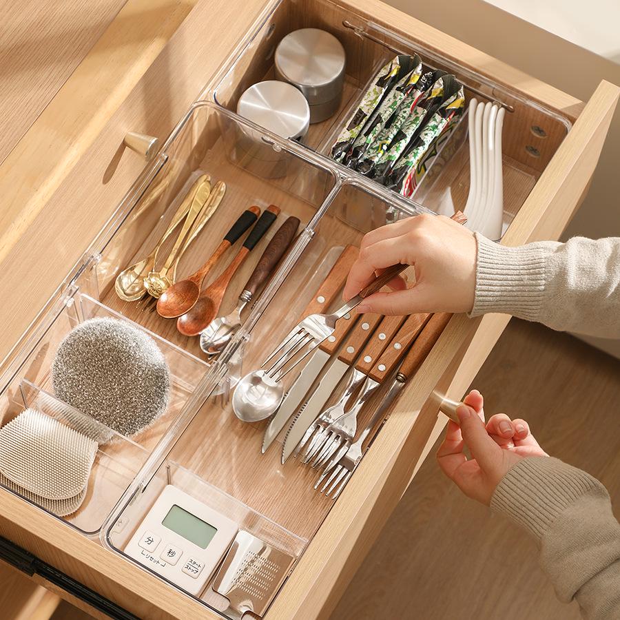 Expandable Transparent Storage Box with Dividers for Utensils, Cosmetics, and Sundries.