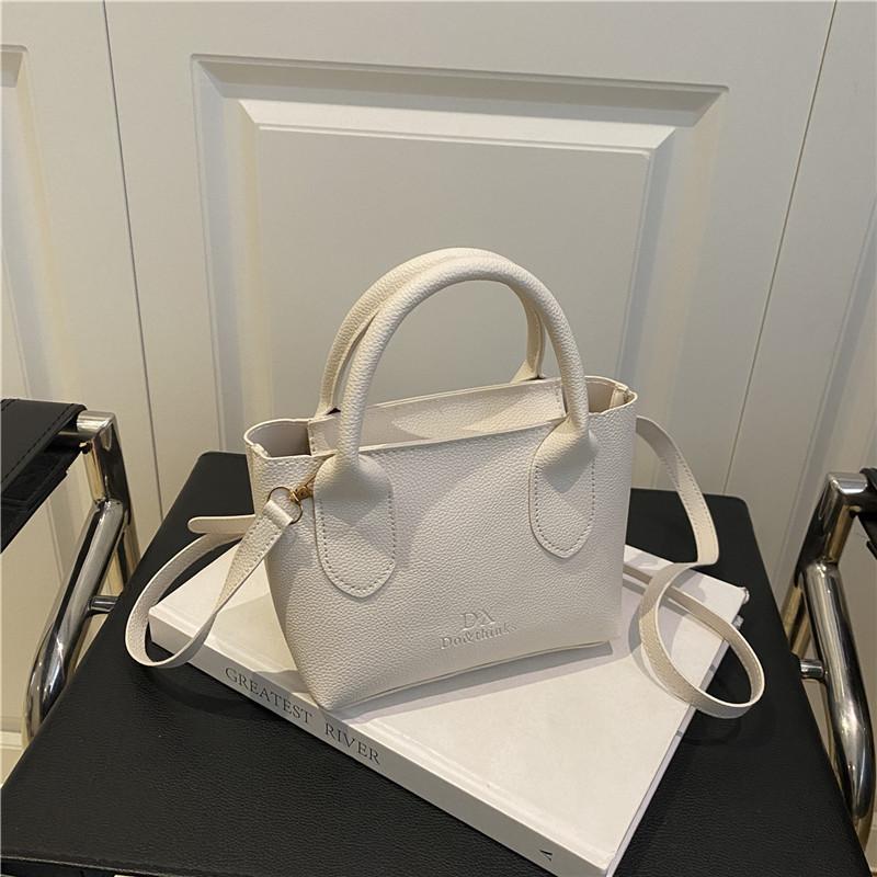 

Летняя новая мода простая однотонная атмосферная портативная сумка-ведро женская дорожная на плечо сумка-мессенджер белый