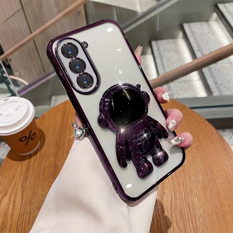 Astronaut Stand Suitable for Samsung S24ultra Mobile Phone Case S23Plus Gradient Flash Powder S22 Astronaut