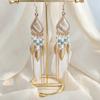 Retro ethnic style woven feathers long fringed earrings, bohemian high-end hollow rice bead earrings