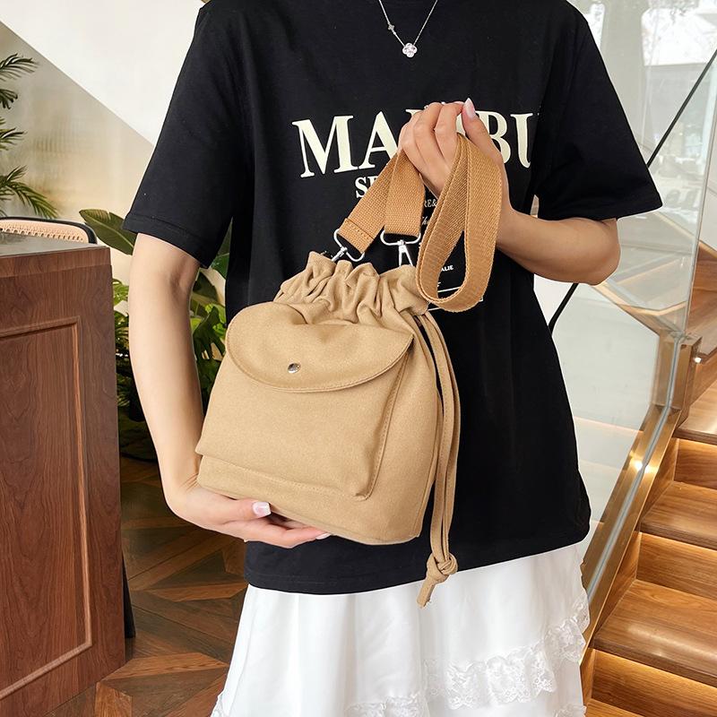 Canvas bag women's spring and summer niche drawstring one-shoulder crossbody bag pleated bucket bag