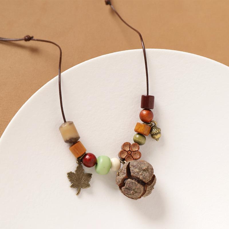 

Retro and elegant necklace with natural acorn pendant, ethnic style long sweater chain