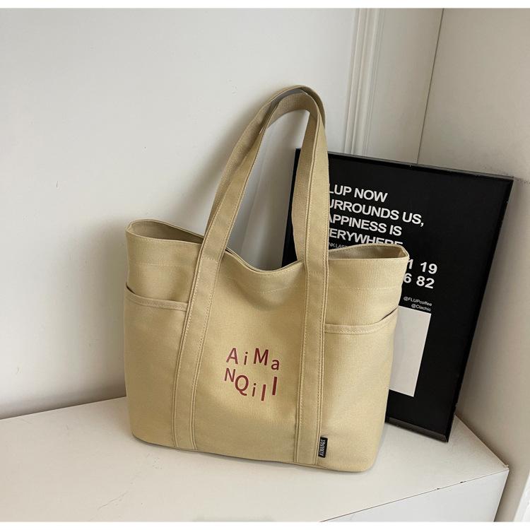 Lässige Canvas-Tragetasche Damen Herbst und Winter Schlichte Große Kapazität Ausgehen Leichte Tragetasche Pendlertasche