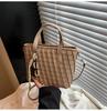 Retro woven small bag women's 2025 new niche design portable bucket bag commuter shoulder messenger bag