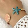 Elegantes farbiges Muschel-Seestern-Offen-Armreif für Damen Vintage Metallstrukturierte Muschel-Manschettenarmband Strandurlaub Schmuck Geschenk