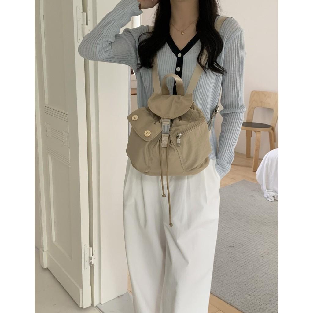 IELGY new Korean niche design outdoor pocket button drawstring double shoulder nylon backpack