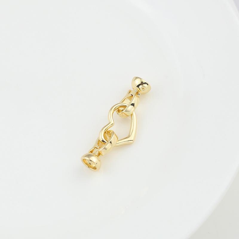 Naszyjnik i łącznik do bransoletki w kształcie owalnego brzoskwiniowego serca zachowujący kolor z podwójnym zapięciem