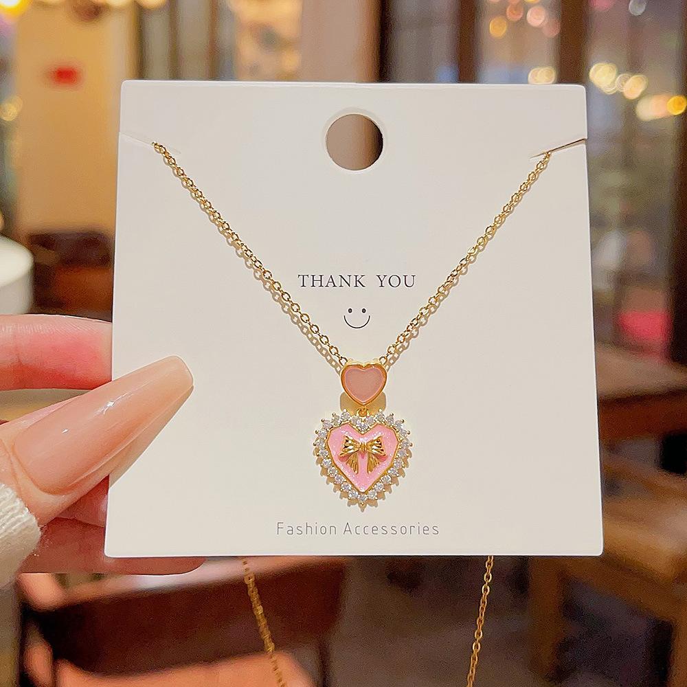 

Кулон-бантик, роскошное ожерелье, цепочка для ключицы, ожерелье со сладким сердечком, женские нишевые титановые аксессуары розовый