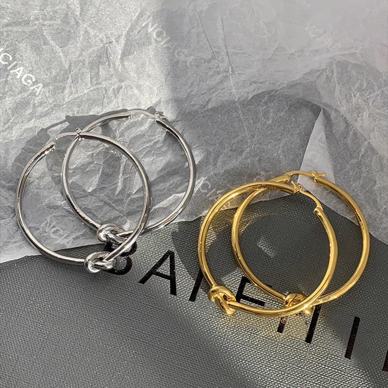 European & American Silver Knot Large Hoop Earrings for Women - High-End Gold Ear Cuffs with Unique, Elegant Design.