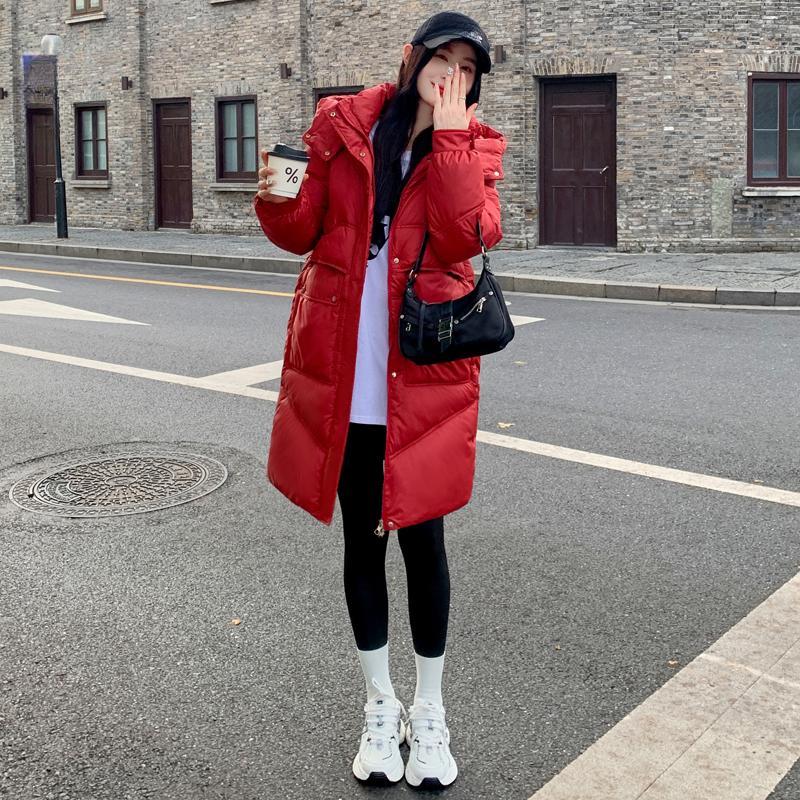 Μείνετε ζεστή και κομψή τον χειμώνα με αυτό το γυναικείο παλτό με κουκούλα μεσαίου μήκους σε κορεατικό στυλ.