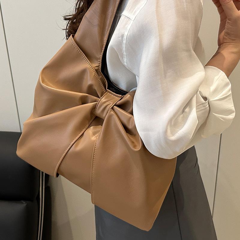 Korean version of casual underarm women's bag 2025 new simple bow design sense tote bag simple portable shoulder bag