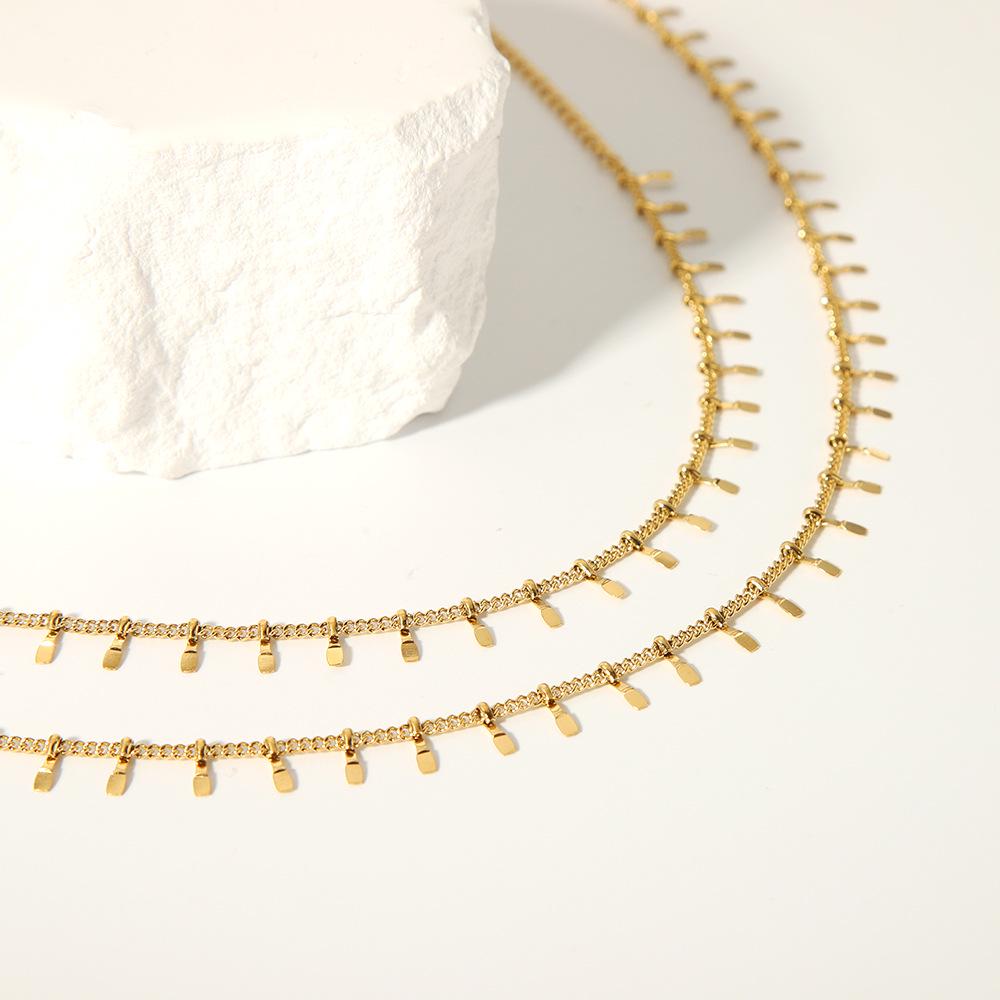 High-End European & American Tassel Choker: 18K Gold Stainless Steel Necklace & Clavicle Chain Bracelet for Women.
