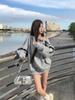 American-Style Oversized Off-Shoulder Sweater: Letter Print, Long Sleeve, Casual Loose Fit for Women In Early Autumn.