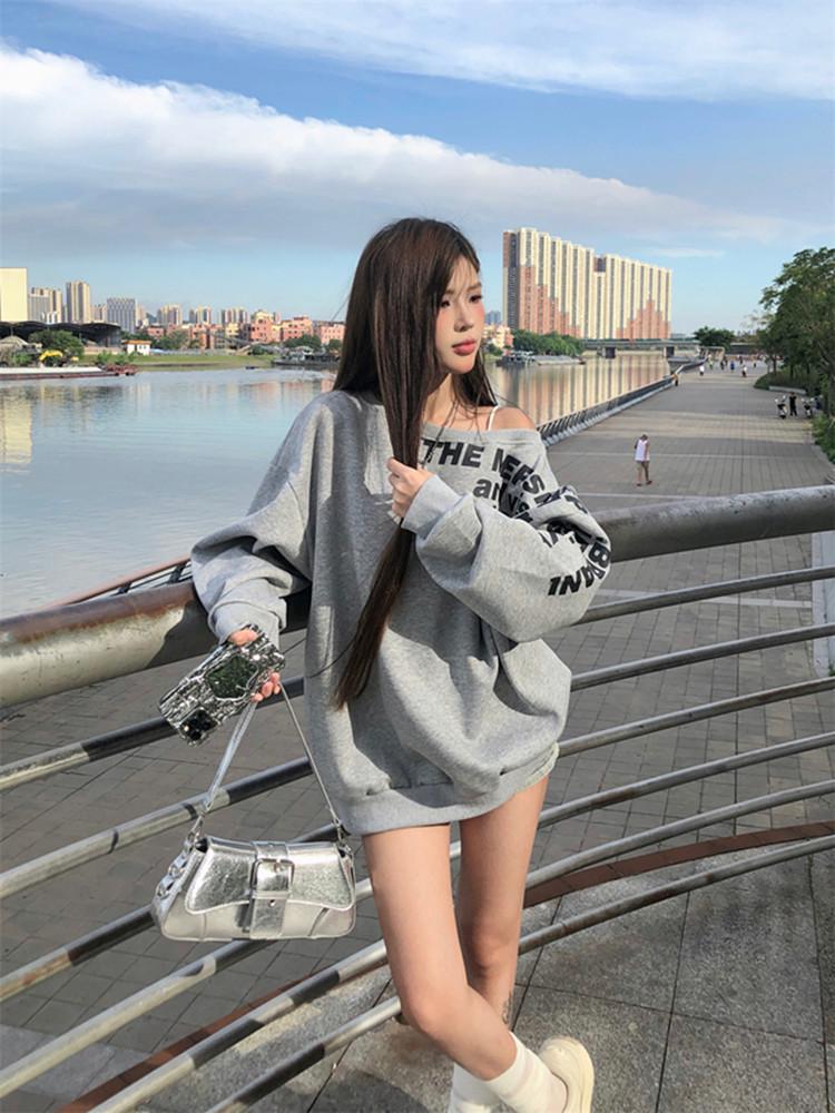 American-Style Oversized Off-Shoulder Sweater: Letter Print, Long Sleeve, Casual Loose Fit for Women In Early Autumn.