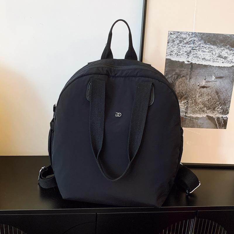 

2025 лето новый рюкзак ультралегкий пуховик школьная сумка дорожная сумка для мамы и малыша для поездок водонепроницаемый рюкзак женский чёрный