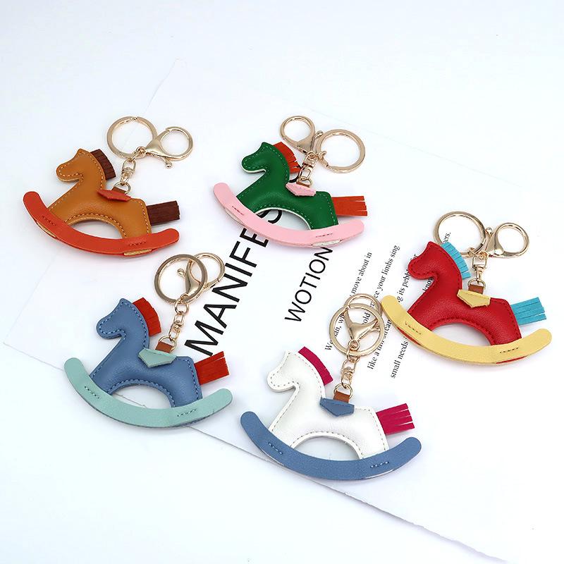 Cartoon Rocking Horse Keychain: Creative PU Leather Pony Charm with Cotton Filling.