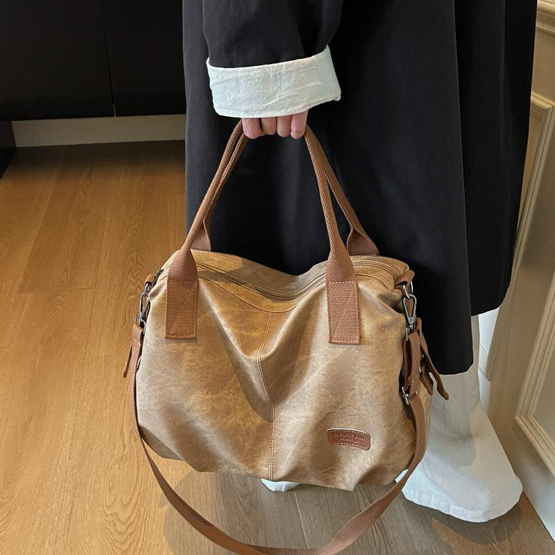 Fashion large-capacity travel bag contrasting colors 2025 casual retro canvas versatile messenger bag shoulder bag handbag