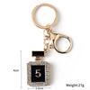 Exquisite Rhinestone-Inlaid Perfume Bottle Pendant Necklace & Car Keychain