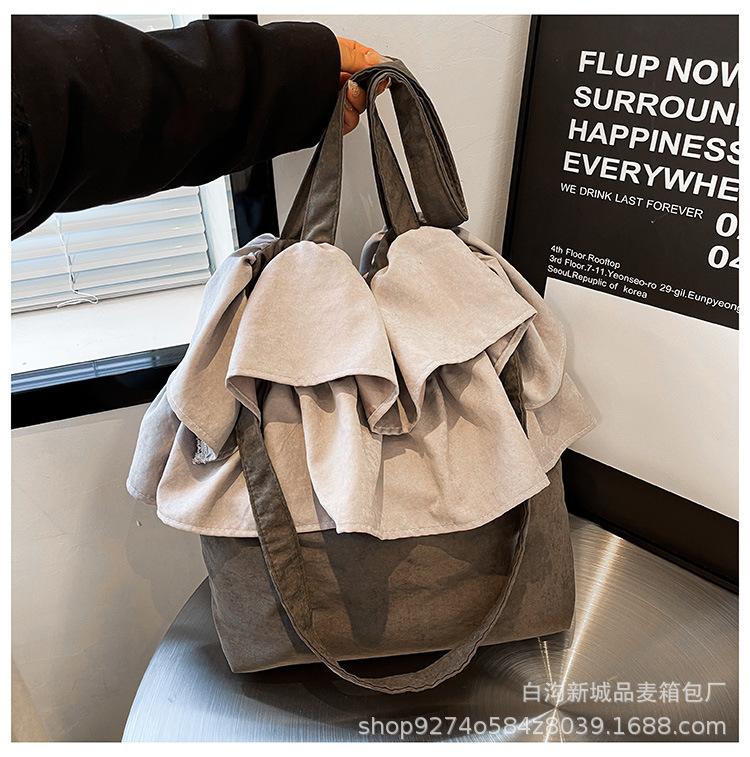 

Korean version of fashion lazy wind bud cloth bag women s bag 2025 new simple contrasting color large-capacity bucket bag серый