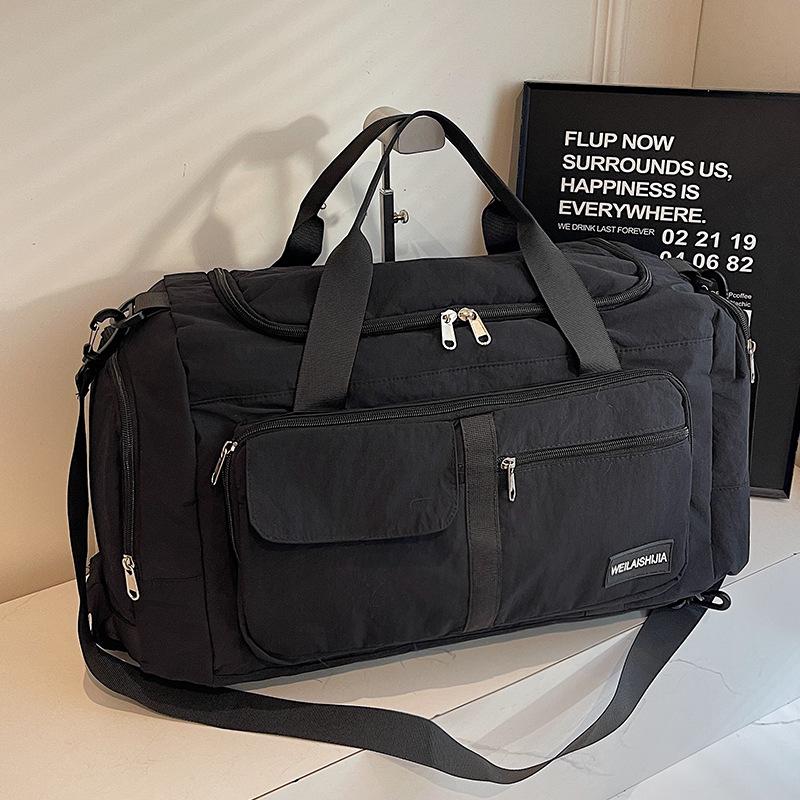 Large Capacity Waterproof Lightweight Travel Bag for Men and Women - Fashionable Handheld Storage for Short Trips and Sports.