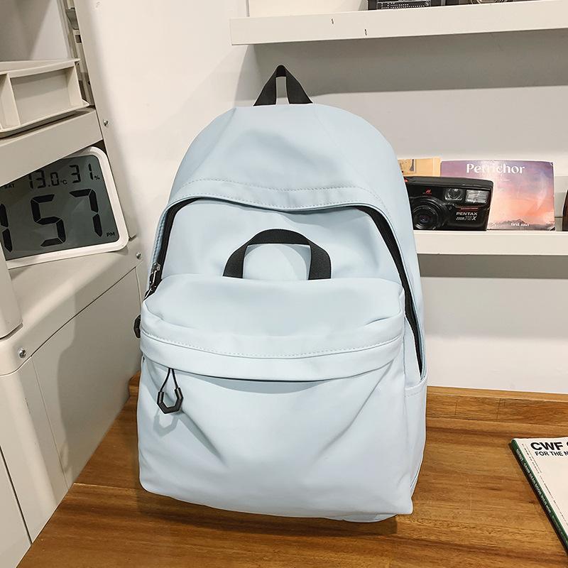 Casual large-capacity backpack fashionable outdoor lightweight junior high school students solid color simple schoolbag Korean version travel backpack