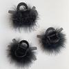 Eleganter Damen-Haarclip für mittellanges Haar mit Design aus schwarzen und kaffeefarbenen Federkrallen