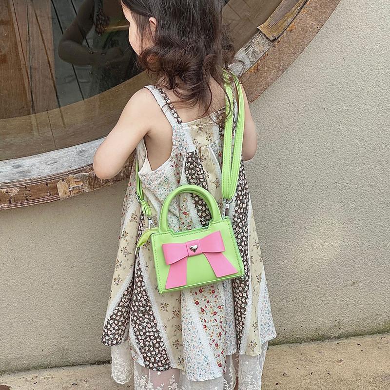 Stylish Korean Toddler Shoulder Bag For Kids Featuring Chic Color Block Design And Sweet Bow Detail