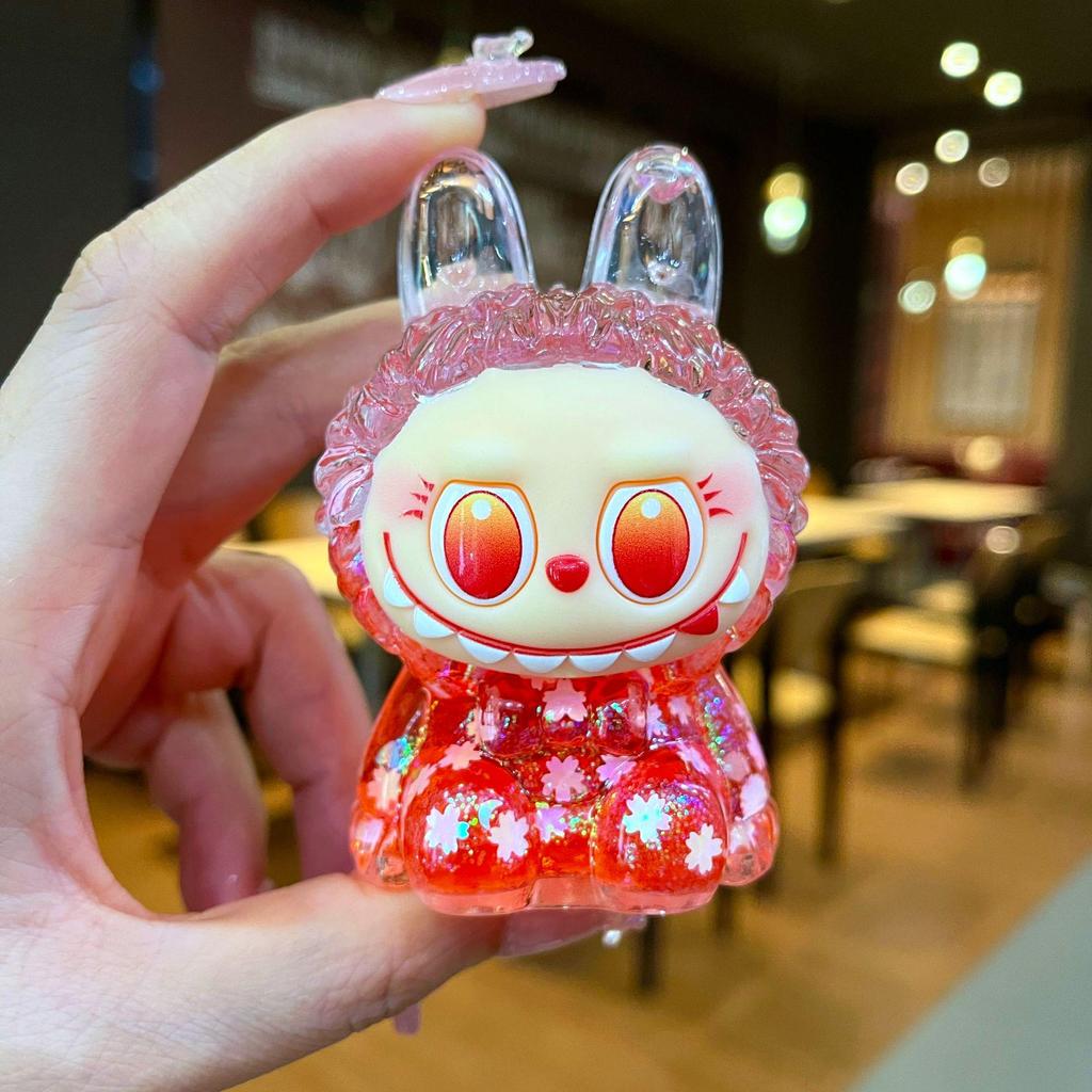 Kurutulmuş Çiçekler, Yanıp Sönen Renkli Boncuklar ve Yağ Şişesi ile Mengmeng Tavşan Hareketli Kum Süsleri - Sevimli Tahıl Aksesuarları ve Douyin'de Trend Oyuncaklar.