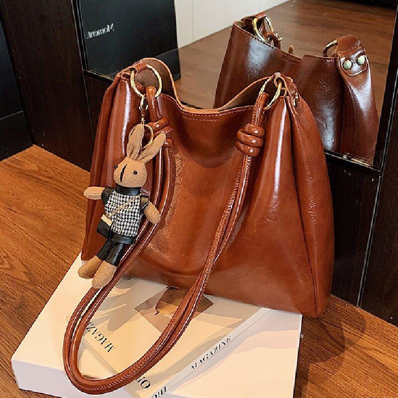 

Niche autumn bag women s fashion simple commuting large capacity shoulder messenger bag коричневый